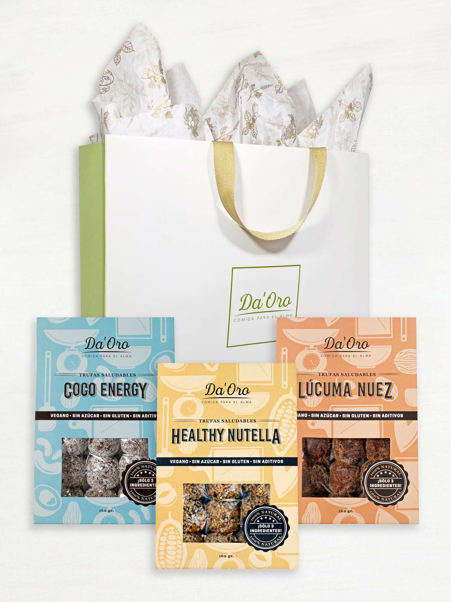 Bolsa de regalo marca Da'Oro con tres cajas de trufas de distinto color